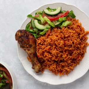 48oz bowl of Ghana Jollof, chicken and Salad
