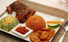 48oz bowl of Ghana Jollof, chicken, fried sweet plantain and Salad